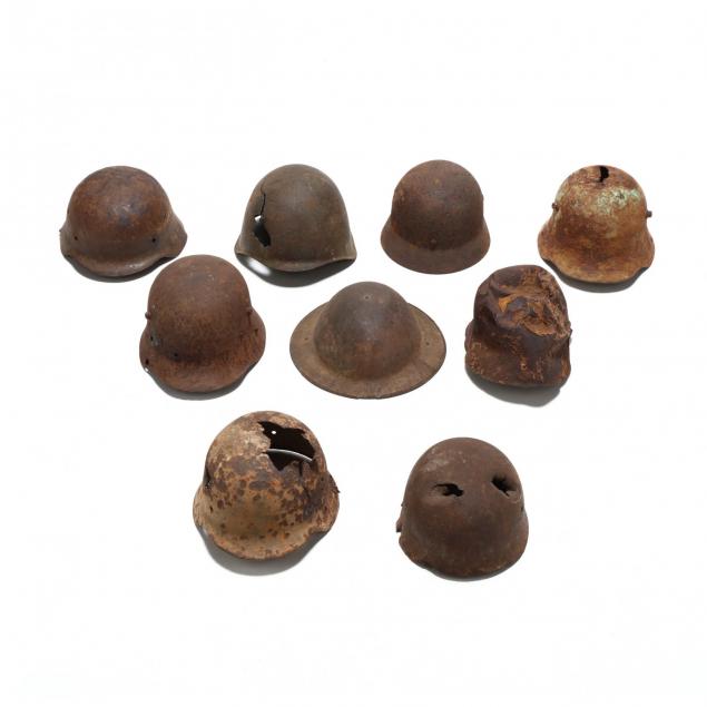nine-battlefied-excavated-wwi-and-wwii-helmets