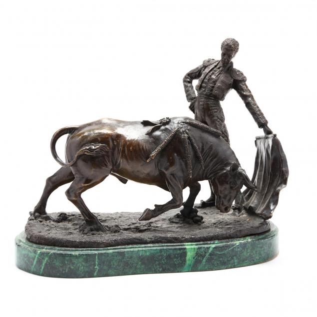 a-bronze-sculpture-of-a-matador-with-charging-bull