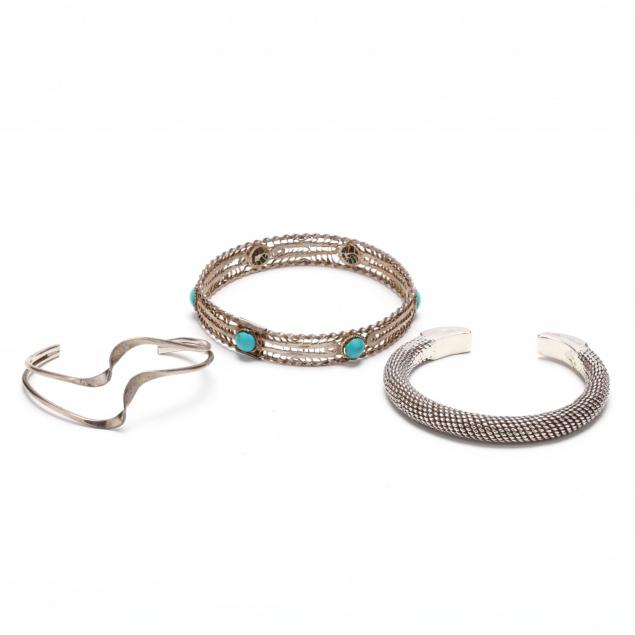 three-silver-bracelets