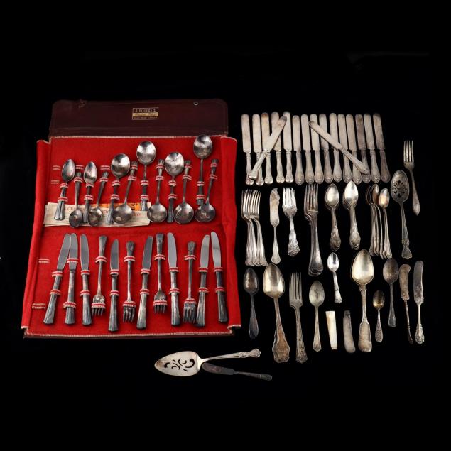a-large-group-of-silverplate-flatware
