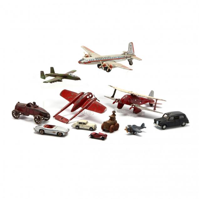 a-group-of-vintage-toy-planes-and-vehicles
