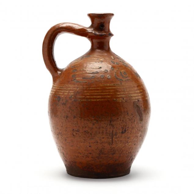 a-continental-redware-candle-jug