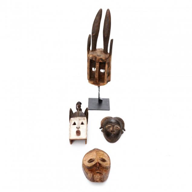 four-african-carved-wood-masks