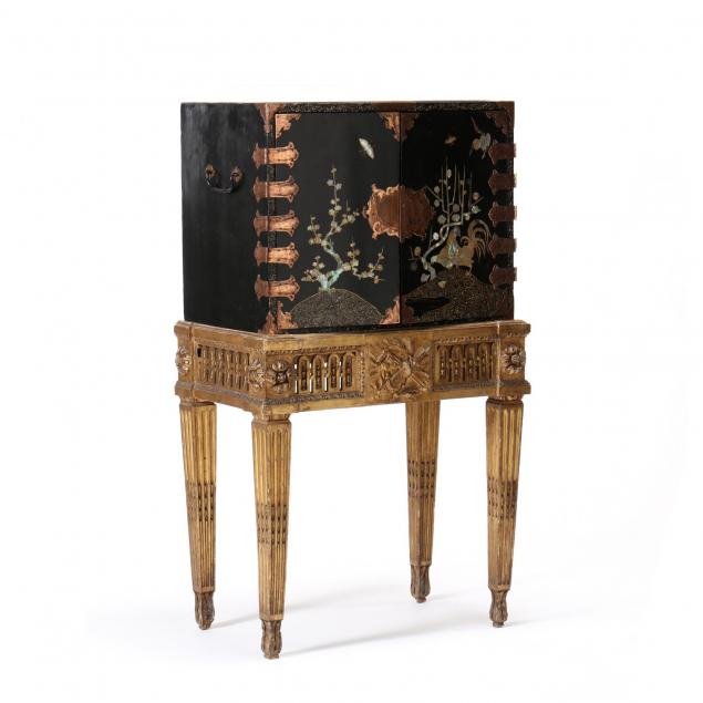 a-japanese-lacquered-cabinet-on-a-carved-giltwood-stand
