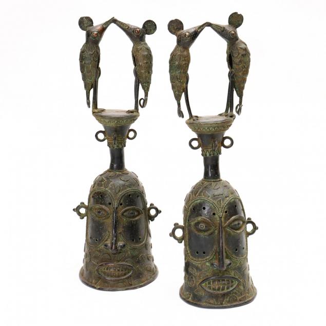two-west-african-figural-bronze-helmets