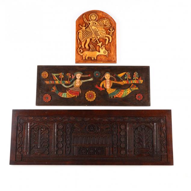 three-carved-wooden-panels