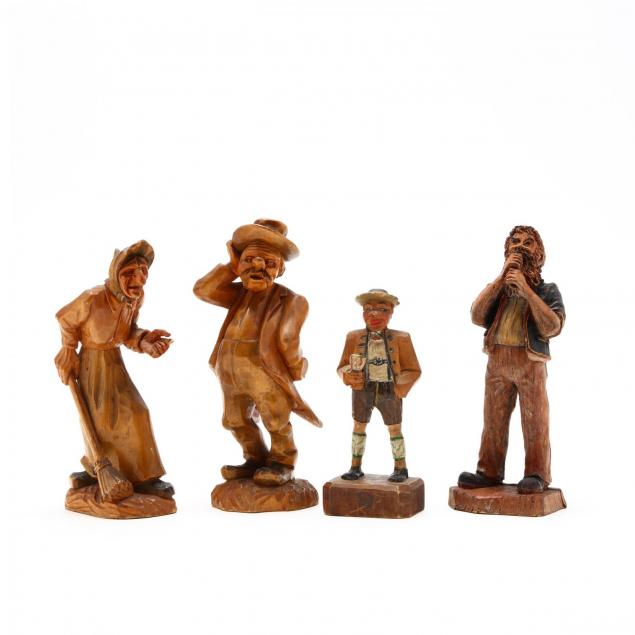 four-carved-black-forest-figures