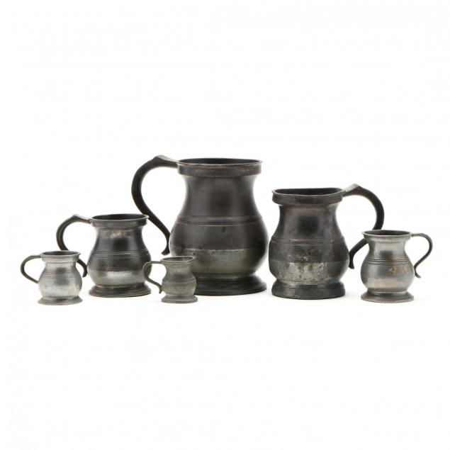 group-of-assembled-pewter-graduated-measuring-cups