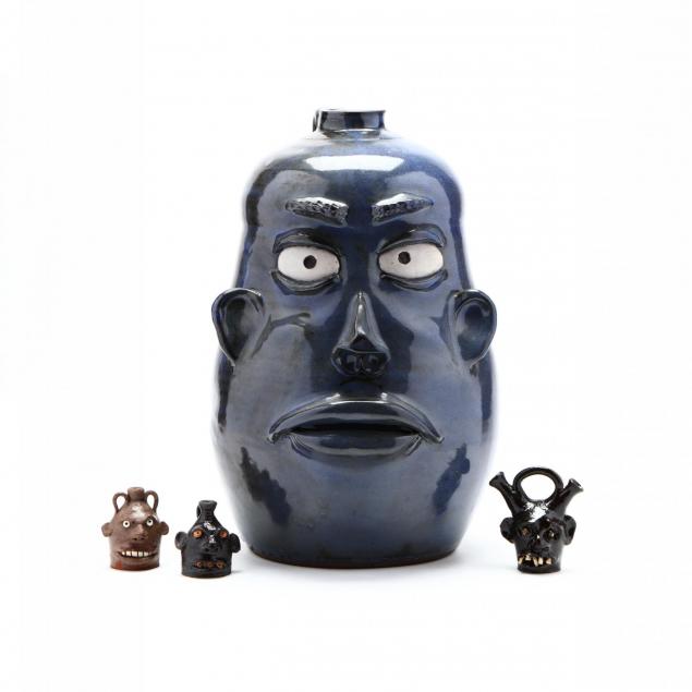 a-group-of-southern-pottery-face-jugs