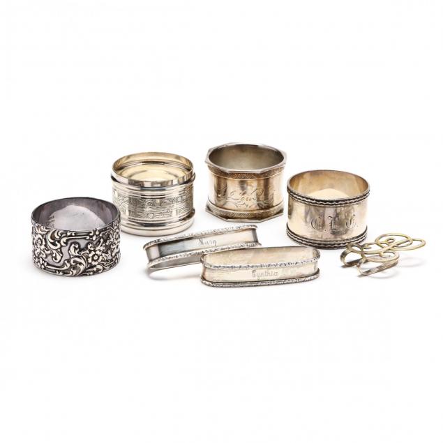 an-assembled-collection-of-seven-sterling-silver-silverplate-napkin-rings
