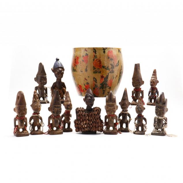 thirteen-carved-african-figures-in-chinese-basket