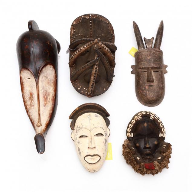 a-group-of-five-african-tribal-masks