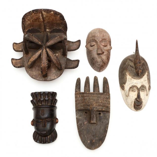 a-group-of-five-african-tribal-masks