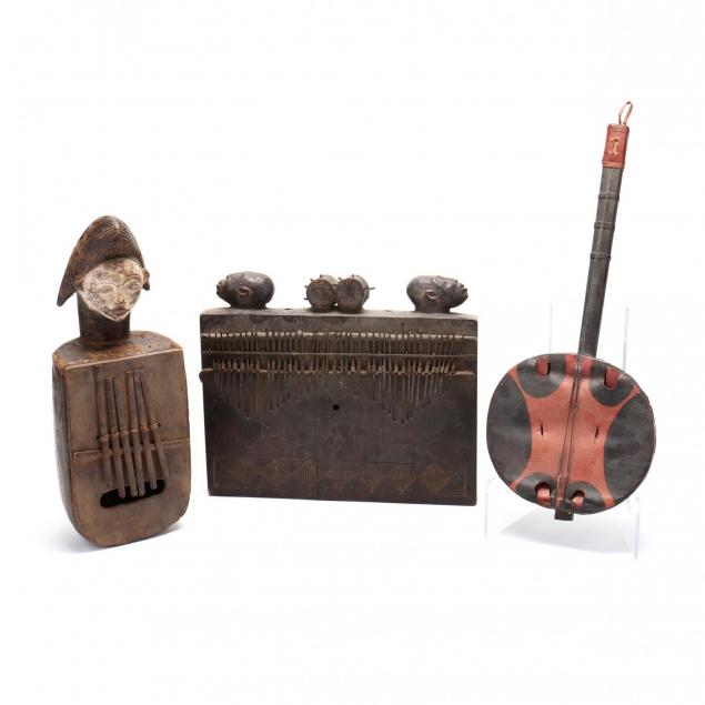 three-african-carved-wood-musical-instruments