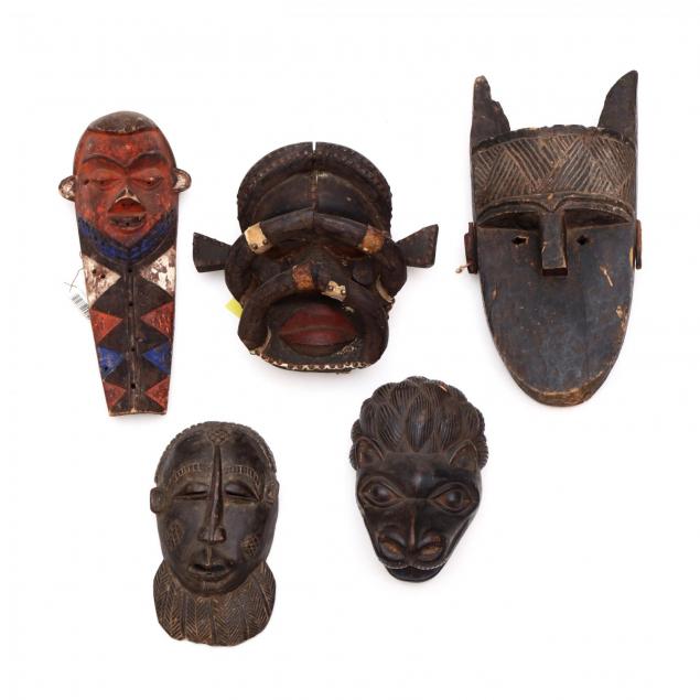 a-group-of-five-african-tribal-masks