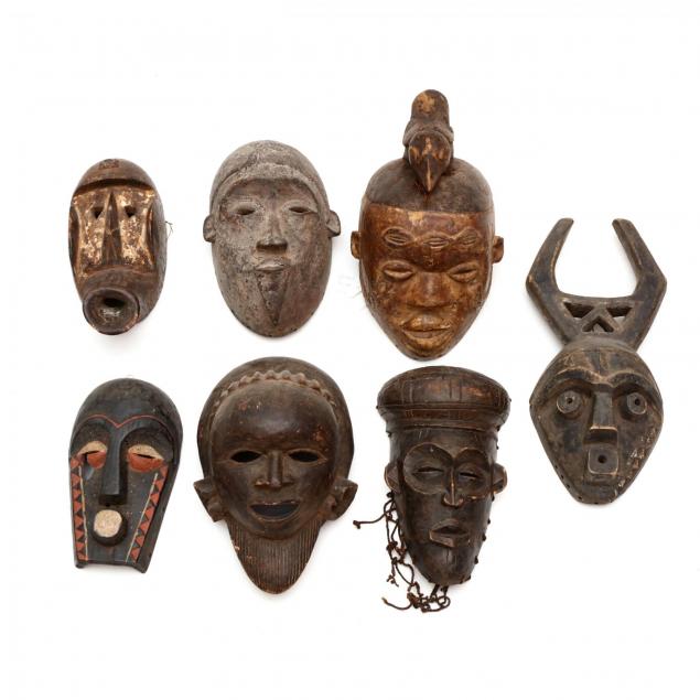 a-group-of-seven-african-tribal-masks