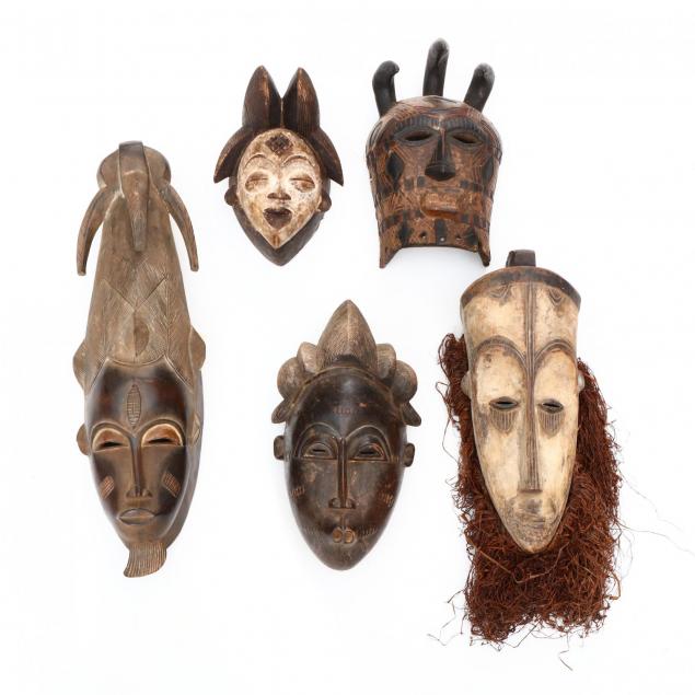 a-group-of-five-african-tribal-face-masks