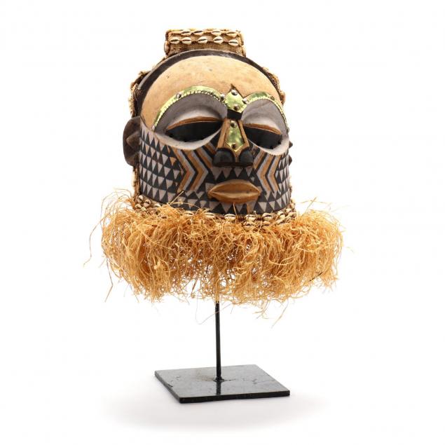 songye-carved-wood-helmet-mask-on-stand