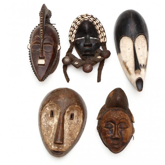 a-group-of-five-african-tribal-masks