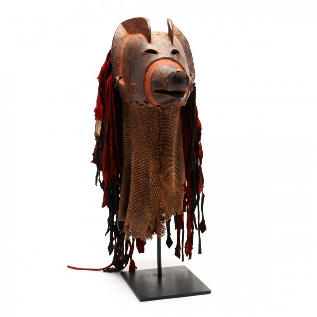 african-carved-zoomorphic-mask-on-stand