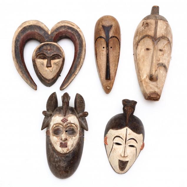five-african-tribal-carved-wood-face-masks