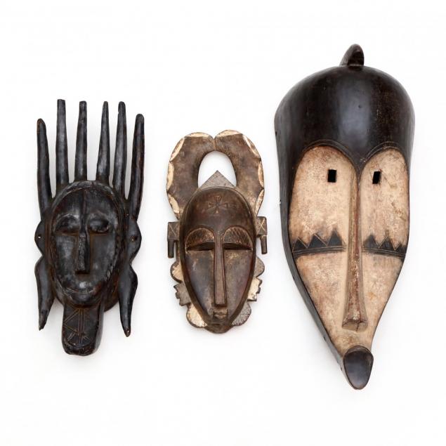 three-african-carved-wooden-masks