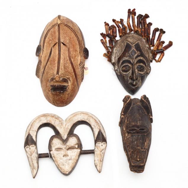 four-african-carved-wood-tribal-masks