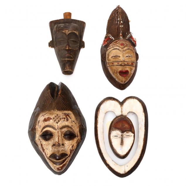 four-african-carved-wood-tribal-masks