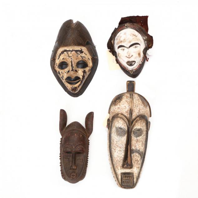 four-african-carved-wood-tribal-masks