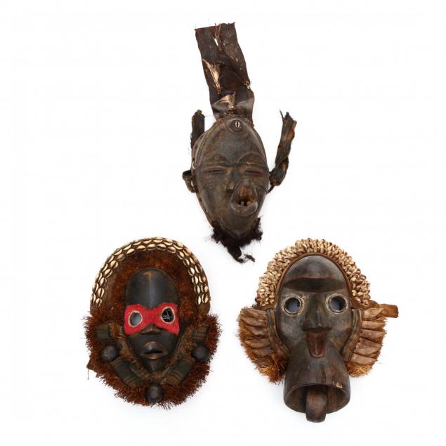 three-carved-and-decorated-dan-masks