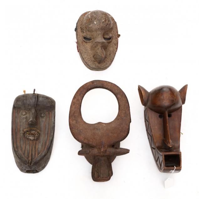 four-african-tribal-masks-three-with-animal-motifs
