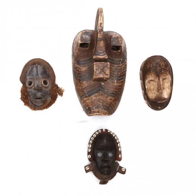 four-african-carved-tribal-masks