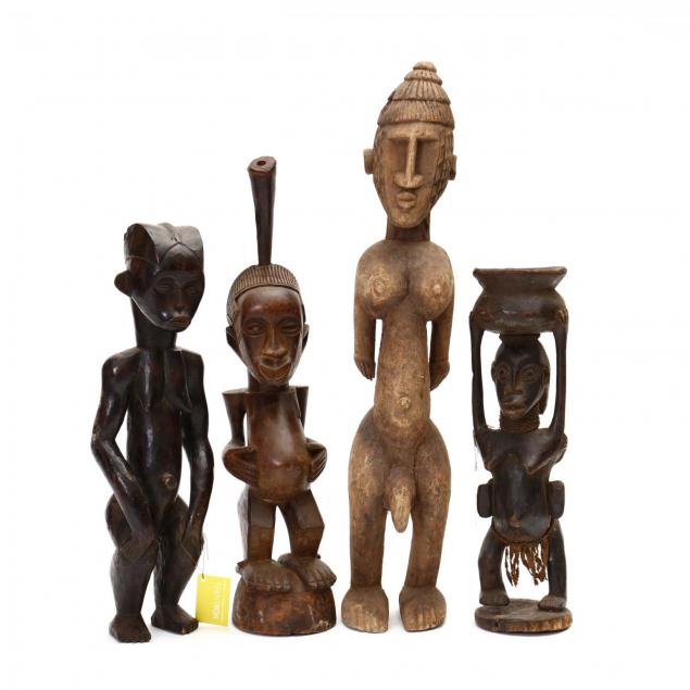 four-african-carved-wood-tribal-statues