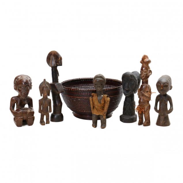 seven-african-figural-carvings-and-a-basket