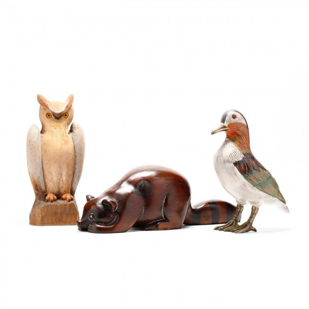 three-carved-wood-animals