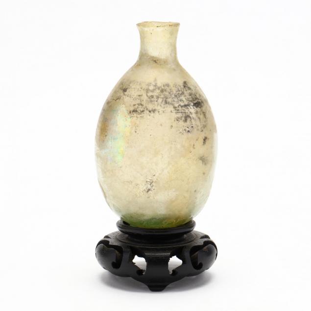 antique-glass-bottle-on-asian-stand