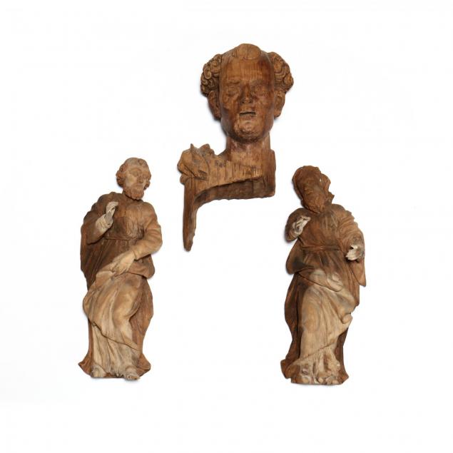 three-antique-wooden-carvings