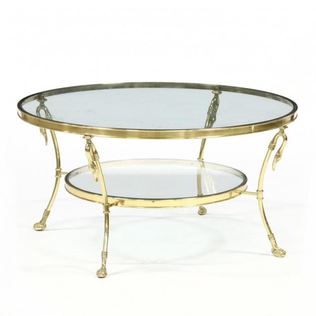 neoclassical-style-figural-brass-and-glass-cocktail-table