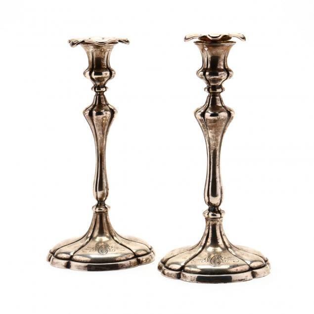 a-pair-of-sterling-silver-candlesticks