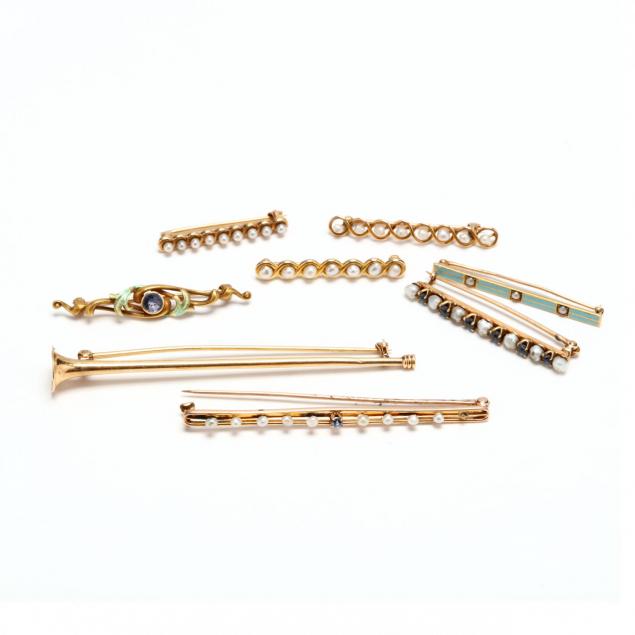 a-group-of-eight-gold-bar-brooches