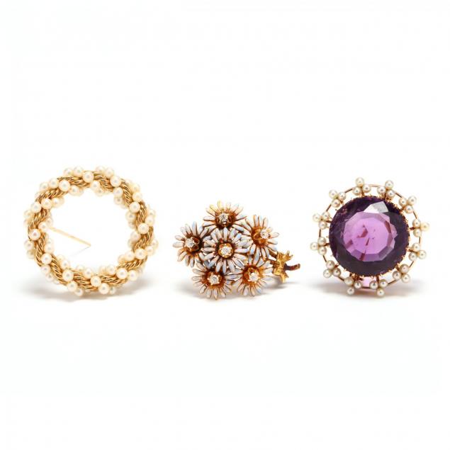 three-gold-and-gem-set-brooches