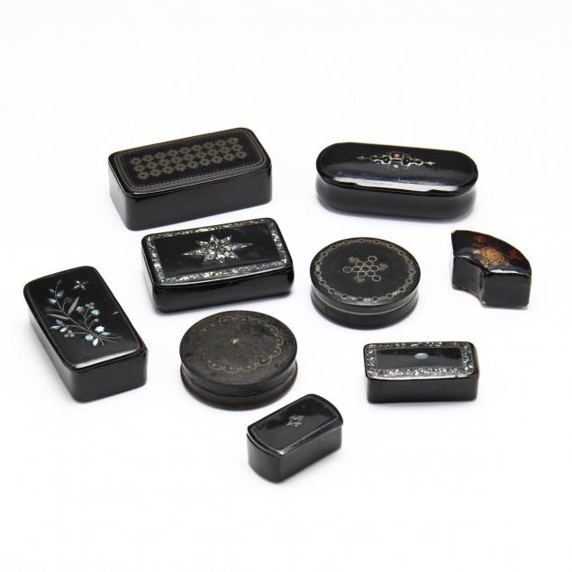 a-group-of-black-lacquered-snuff-boxes