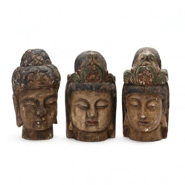 three-contemporary-carved-wood-buddha-heads