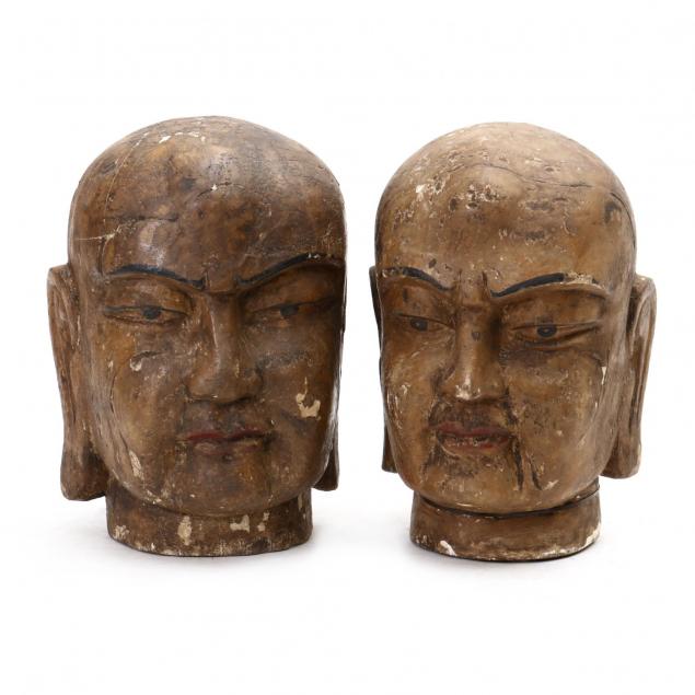 two-carved-wood-buddha-heads