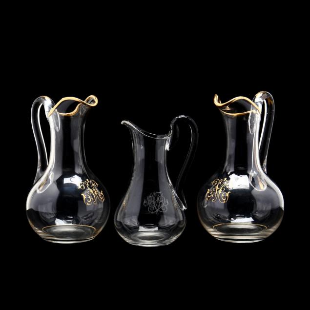 three-19th-century-monogramed-glass-pitchers