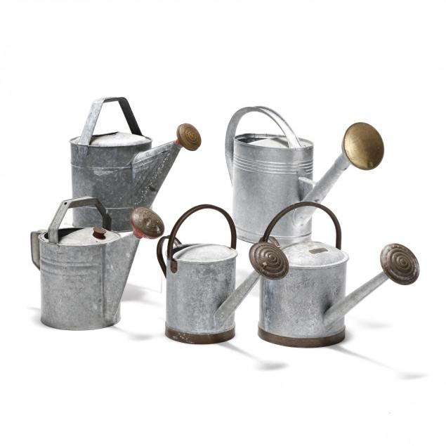 five-vintage-galvanized-metal-watering-cans