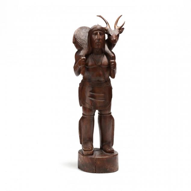 a-vintage-carving-of-an-american-indian-with-deer
