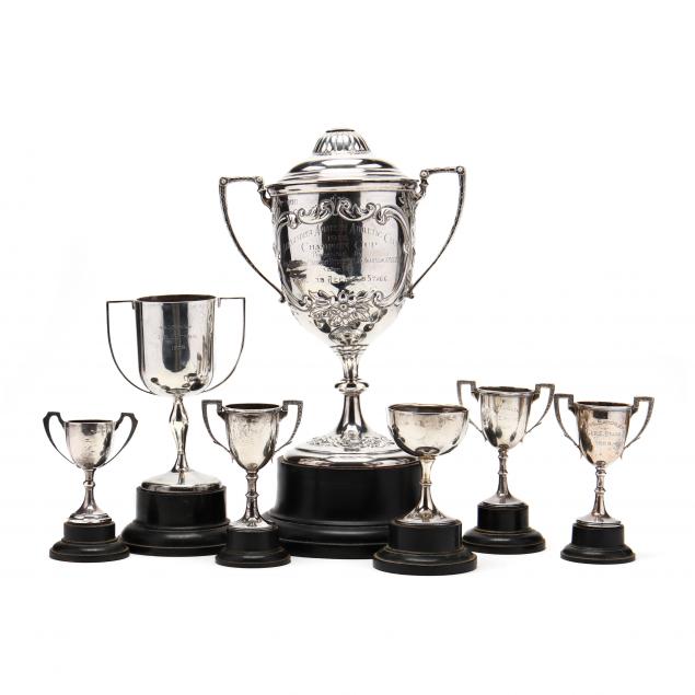 a-collection-of-seven-sterling-silver-trophies