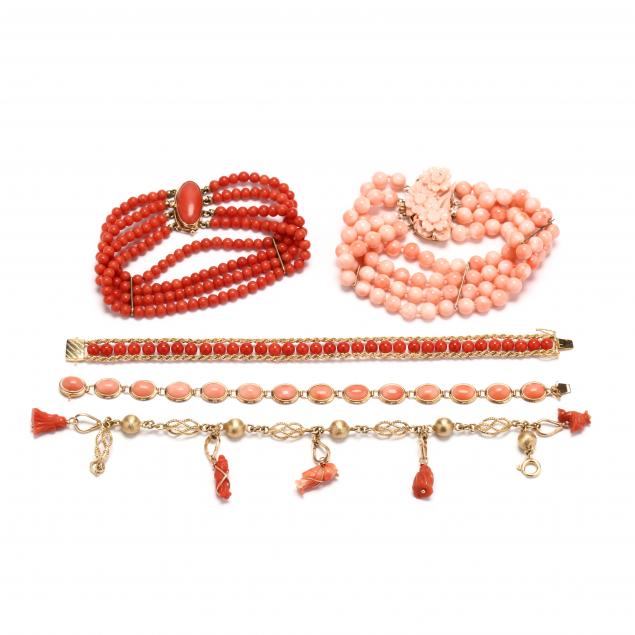 group-of-gold-and-coral-bracelets