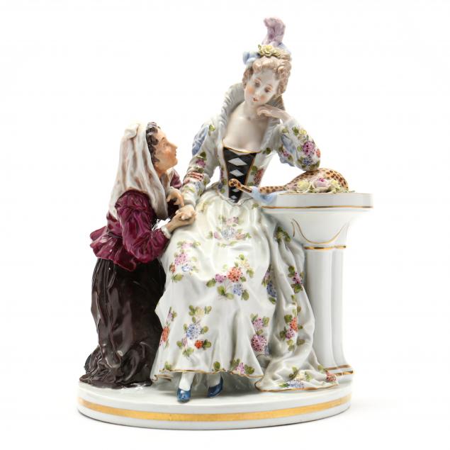 an-antique-continental-porcelain-model-of-a-woman-with-fortune-teller